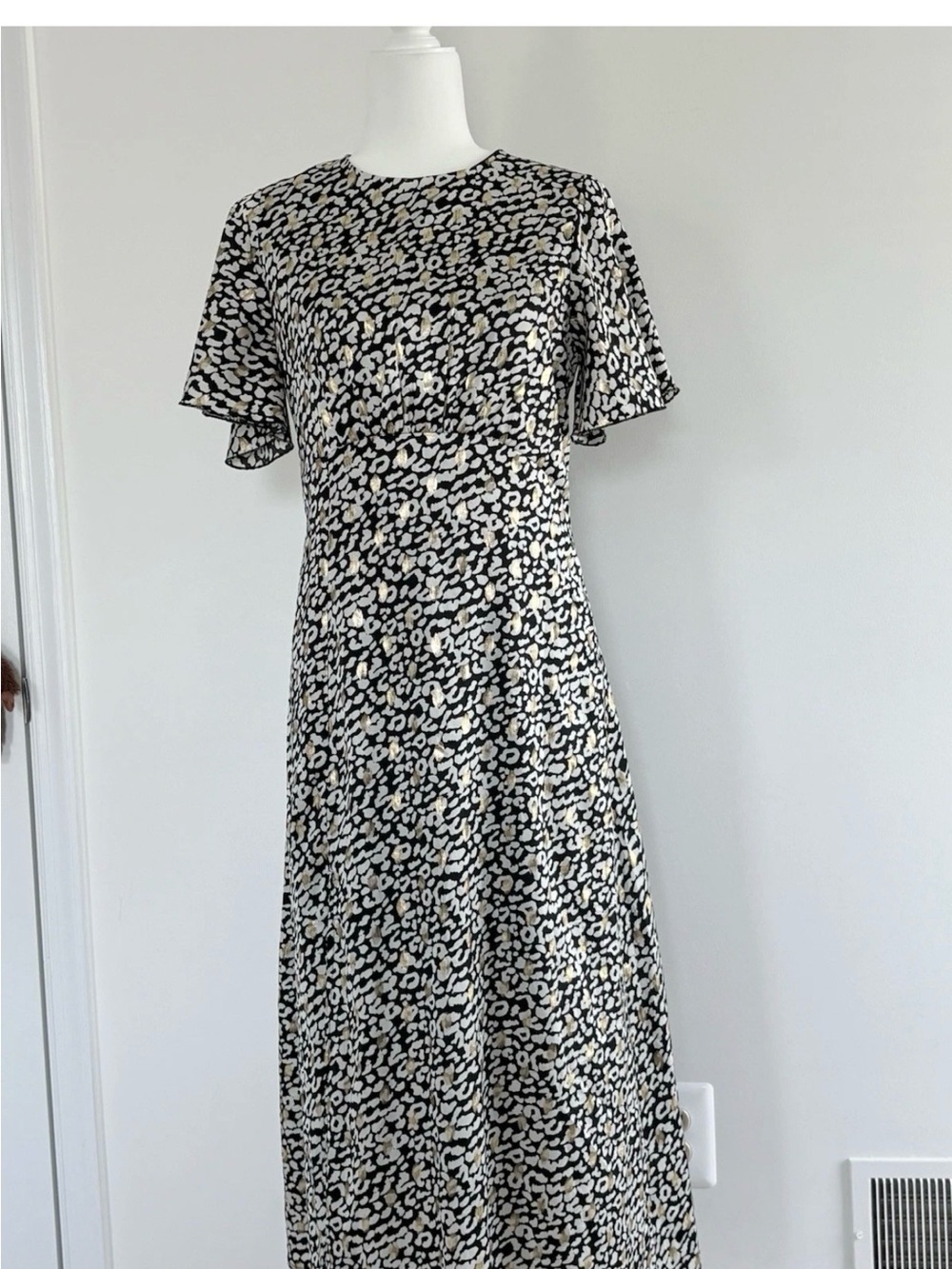 Elegant Black and Gold Printed Maxi Dress with Knee slit